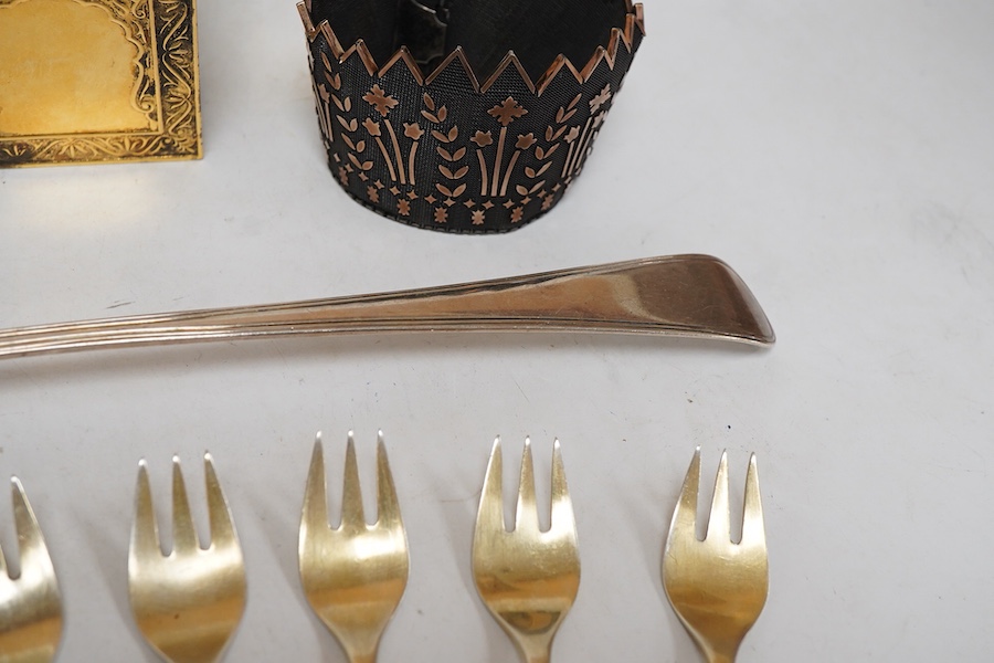 A modern silver gilt Amouage perfume bottle in the form of Oman Palace Ruwi mosque, maker possibly Asprey & Co, London, 1995, height 12.3cm, together with a George III silver Old English thread pattern basting spoon, by